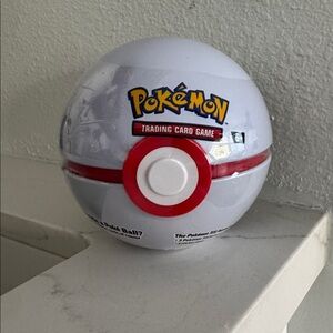 Pokémon tin contains 3 TCG booster packs and 2 sticker sheets